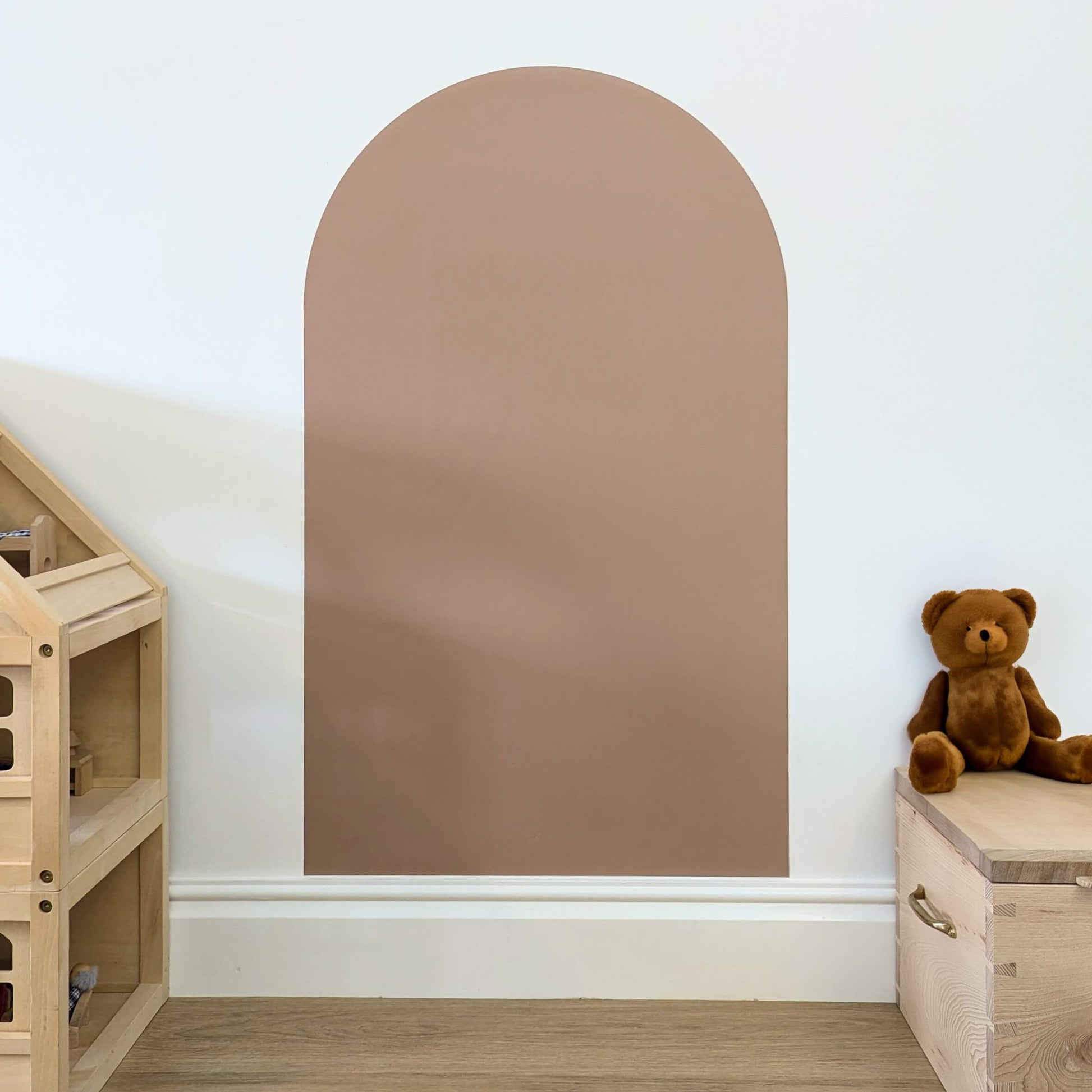 Arch shaped brown coloured wall decal on a white wall