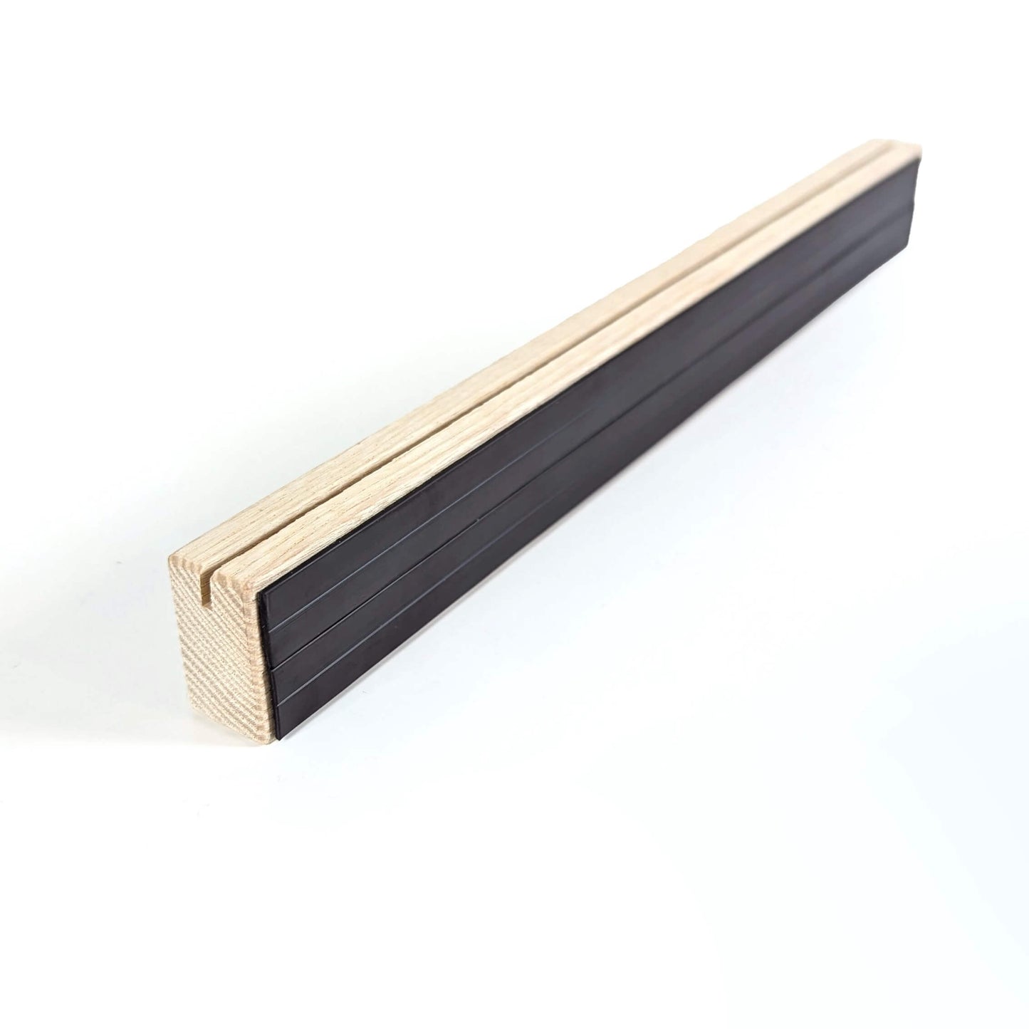 back of 300mm long wooden shelf with soft magnetic backing