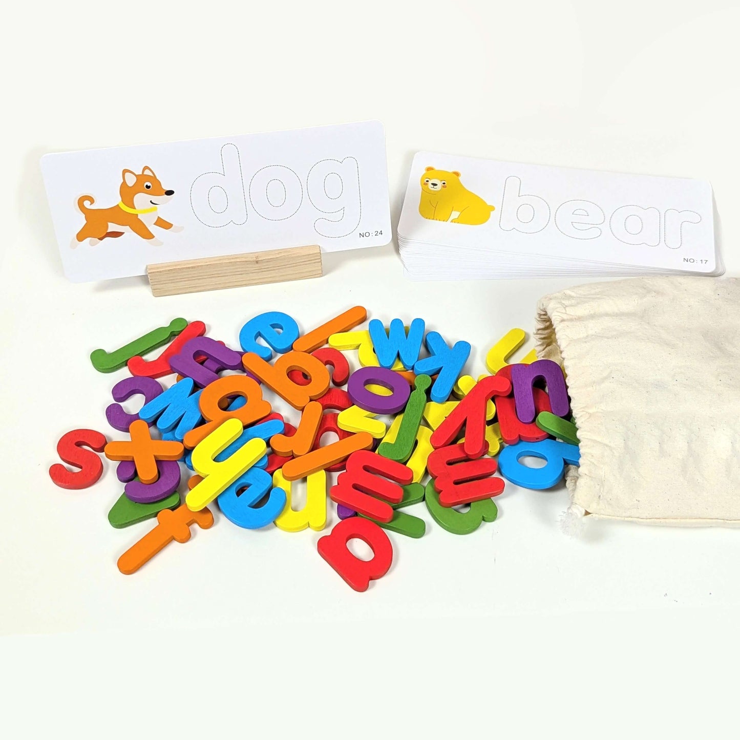 A colourful set of magnetic wooden letters, word spelling cards, wooden holder and cotton storage bag